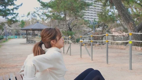 Happy Japanese model dips training in the park Video stock 105639116