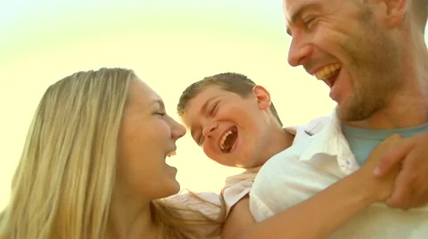 Happy joyful young family father, mother and little son having fun outdoors Stock Footage 59081114