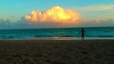 Happy kid jumping in to the beach Stock Footage 133207839