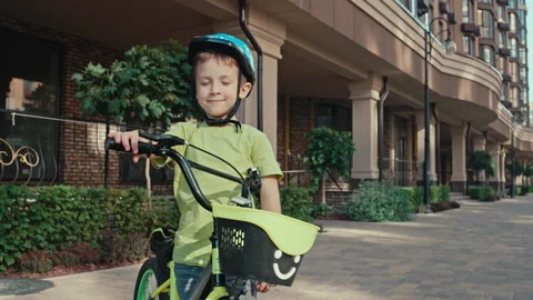 Happy Kid in Protective Helmet Exploring City on Bicycle Adventure Stock Footage 252957335