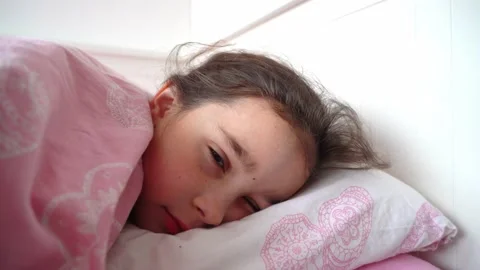 Happy kid waking up in comfortable bed in cozy bedroom Stock Footage 152097165