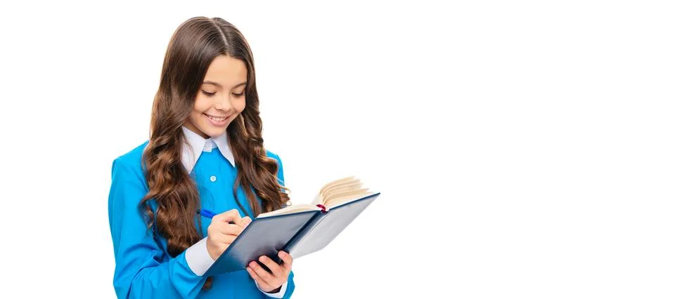 Happy kid write in school exercise book doing written homework assignment Stock Photos