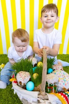 Happy Kids with Easter Eggs and Basket. Holiday. Easter. Copy Space Stock Photos