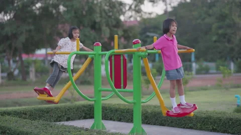 Happy kids playing in playground  库存影片 143201224