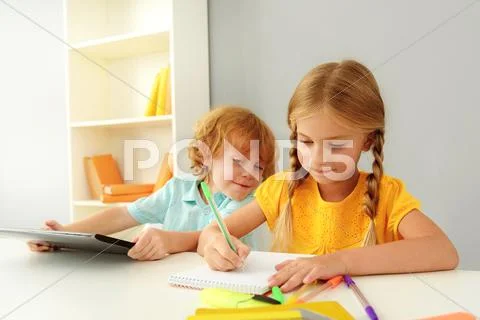 Happy kids studying in kindergarten Stock Photos