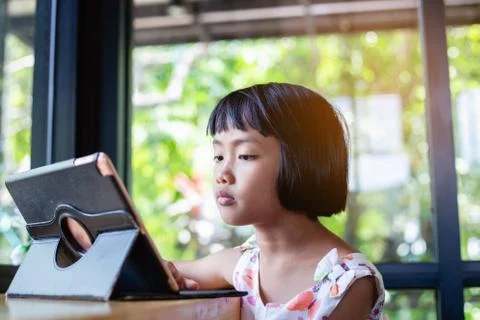 Happy kids using a laptop computer at home 스톡 사진