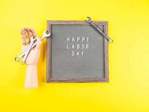 Happy Labor Day greetings on letter board with spanners Stock Photos