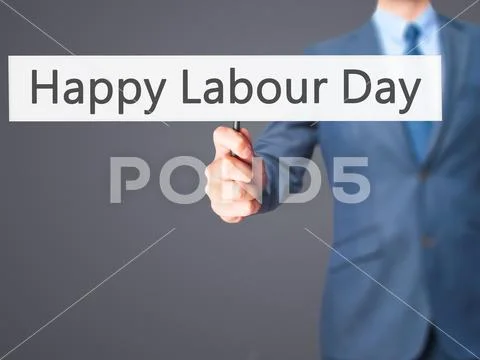Happy Labour Day - Businessman hand holding sign Stock Photos
