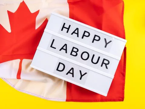 Happy Labour Day greetings on lightbox with canadian flag Stock Photos