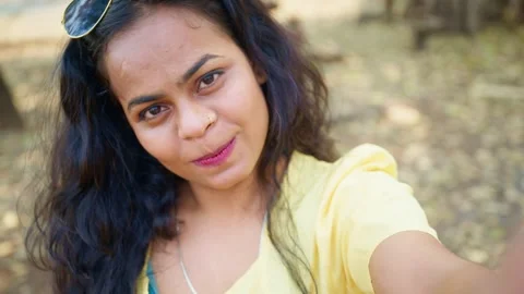 Happy lady snaps self portrait grinning brightly Stock Footage 303963243