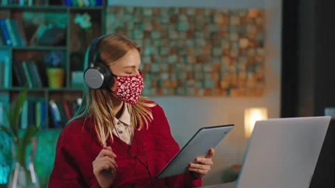 Happy lady student doing her course online from home in pandemic she wearing Video stock 144208319