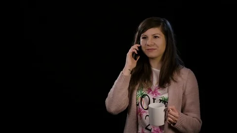 A Happy Lady Using Phone Against Black Background Stock Footage 86589374