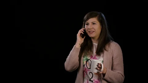 A Happy Lady Using Phone Against Black Background Stock Footage 86590701
