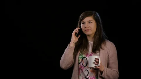 A Happy Lady Using Phone Against Black Background Stock Footage 86590976