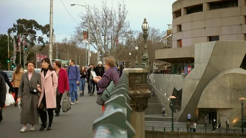 A happy lady using tablet computer taking photos on Princess Bridge Stock Footage 93684385