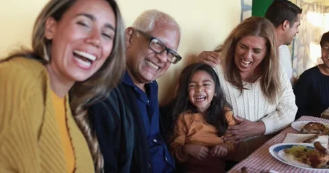 Happy latin family having fun eating together at vintage restaurant Stock Footage