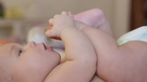 Happy little baby on the bed Stock Footage 53894792