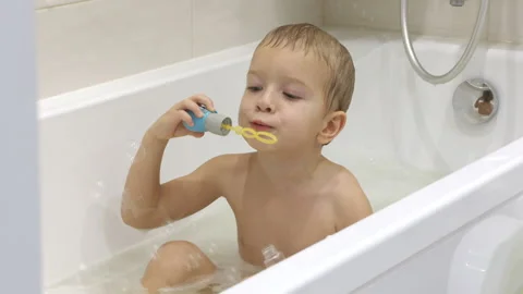 Happy little boy playing in bubble bath. Stock Footage 311275519