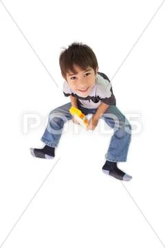 Happy little boy playing with building blocks Stock Photos