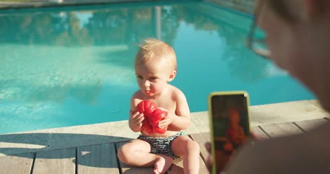 Happy little boy testing tomato first time his life sitting outside. Young Stock-Footage 202511293