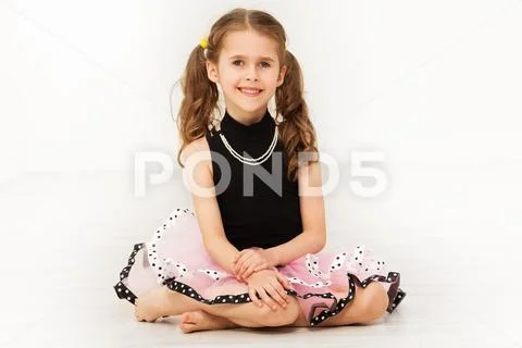Happy little girl in beautiful dress and necklace Stock Photos