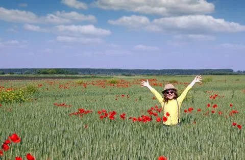 Happy little girl in a meadow 스톡 사진
