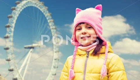 Happy little girl over london ferry wheel Stock Photos