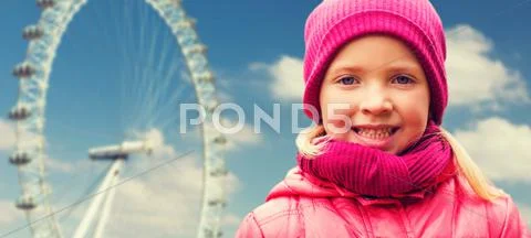Happy little girl portrait over ferry wheel Stock Photos