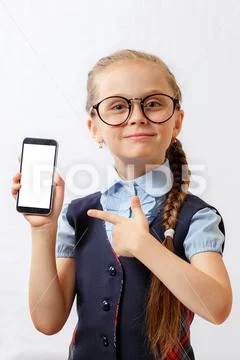 Happy little girl show her smartphone with white screen. mockup Stock ...