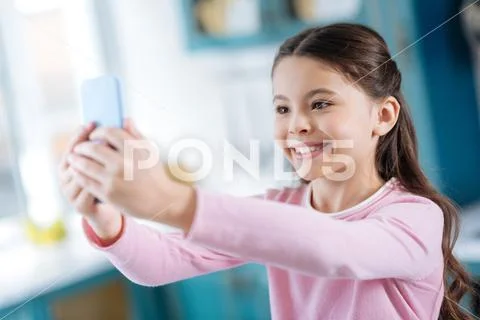 Happy little girl taking selfies Stock Photos
