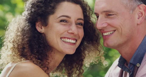 Happy, love and face of couple in park for bonding, quality time and commitment 動画素材 243352553