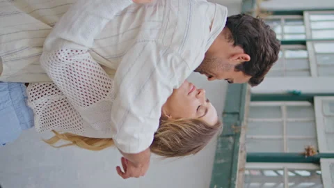 Happy lovers kissing tenderly tiny street vertical closeup. Pair romantic date Stock Footage 277457978