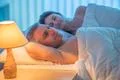 The happy lovers lay on the bed. Evening night time Photo