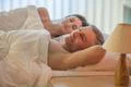The happy lovers lie on the bed Photo