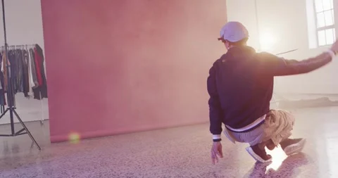 Happy male dancer dancing alone in dance studio, slow motion Stock Footage 341936535