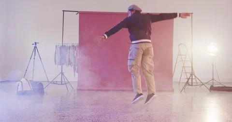 Happy male dancer dancing alone in dance studio, slow motion Stock Footage 343238013