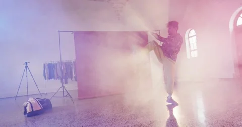 Happy male dancer dancing alone in dance studio, slow motion Stock Footage 344315851