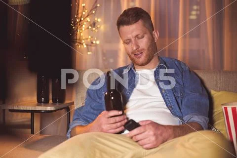 Happy male relaxing at home Stock Photos