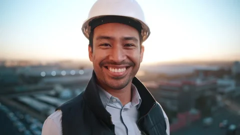 Happy, man and engineer outdoor with face, inspector and architecture for urban Stock Footage 338021818