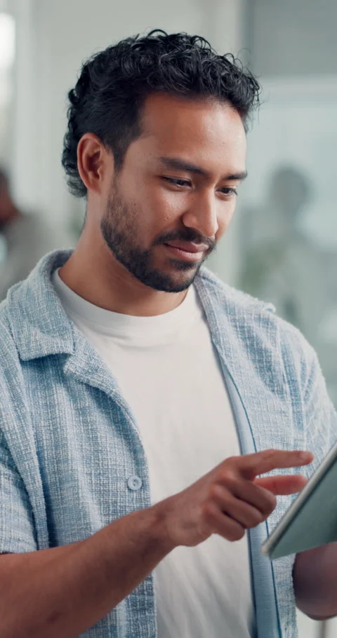 Happy, man and typing with tablet in office for design trends, app testing or Stock Footage 325988988