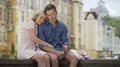 Happy man and woman enjoying carefree summer time, making soap bubbles, kissing 4k or 4k+ Resolution