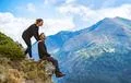 The happy man and a woman enjoying on the beautiful cliff Photo