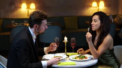 Happy man and woman having romantic dinn... | Stock Video | Pond5