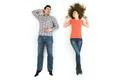 The happy man and woman lay on the white floor. View from above Photo