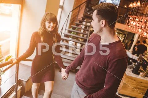 The happy man and the woman stand in the restaurant Stock Photos
