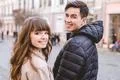 The happy man and a woman walking on the street Photo
