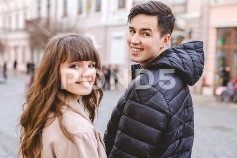 The happy man and a woman walking on the street Stock Photos