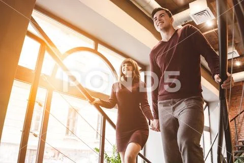 The happy man and the woman walking in the restaurant Stock Photos