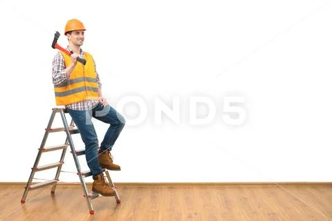 The happy man with the ax standing on the ladder on the white wall background Stock Photos