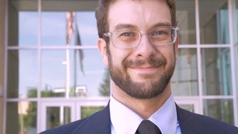 Happy man with beard portrait smiling with American flag reflected in glass Stock Footage 78229893
